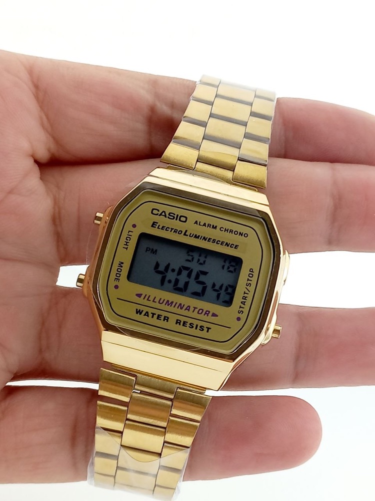 Montre digitale vintage dorée